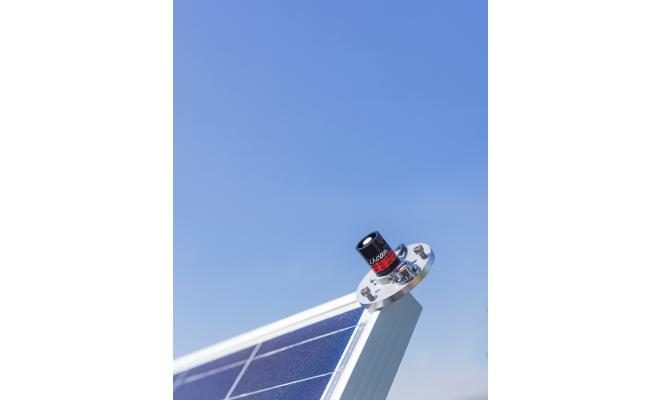 mounting and leveling fixture with light sensor on solar panel