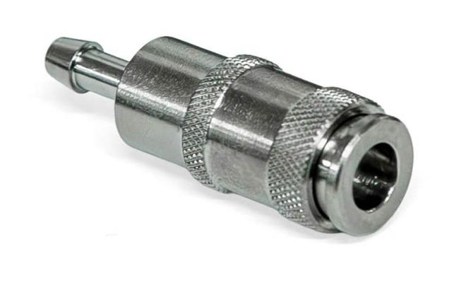 A small silver metal connector with an audio jack sized hole on one side and a barbed nipple on the other side.