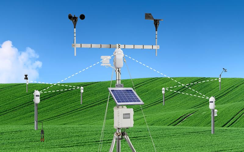 HOBOnet outdoor sensor network and weather station in green field