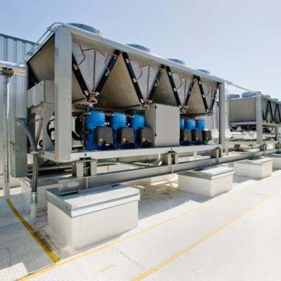 Air conditioning equipment on top of a large building.