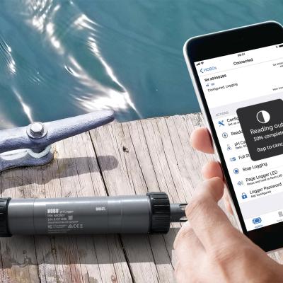 HOBO MX2501 pH and Temperature logger on dock with iPhone