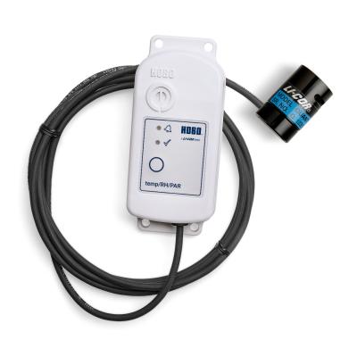 light sensor connected to a temp and humidity data logger via a cable against a white background
