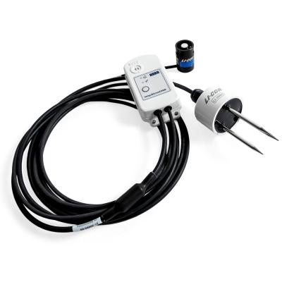 MX2310 studio photo - a small white device connected to 2 senor devices, connected by a long black cable.