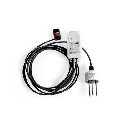 MX2311 studio photo - a small white device connected to 2 senor devices, connected by a long black cable.
