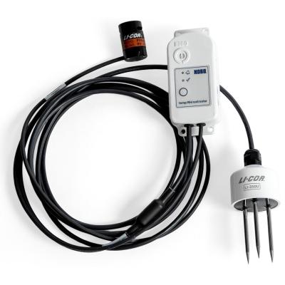 MX2311 studio photo - a small white device connected to 2 senor devices, connected by a long black cable.