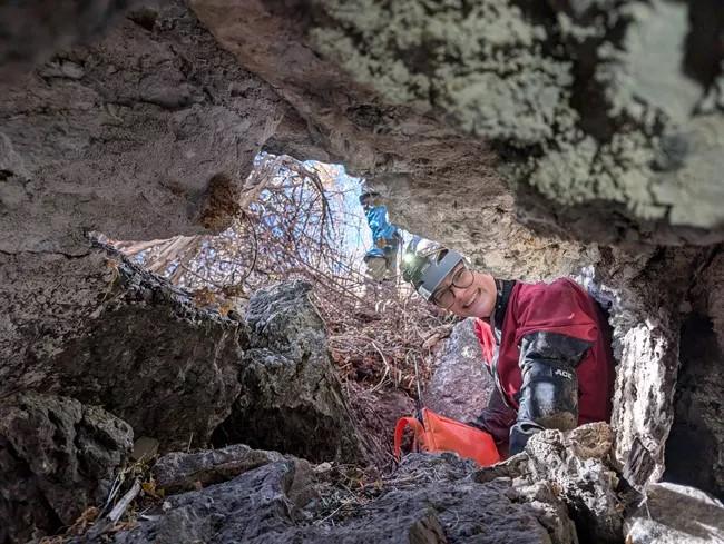 NPS scientist in cave monitoring conditions